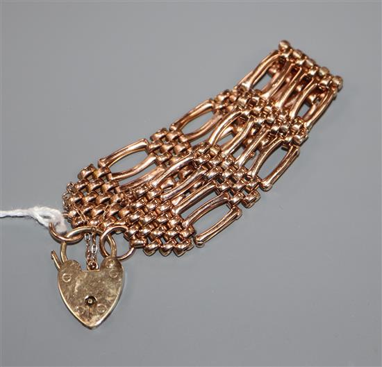 A 9ct rose gold flexible gate-link bracelet with padlock clasp, 23.1 grams.